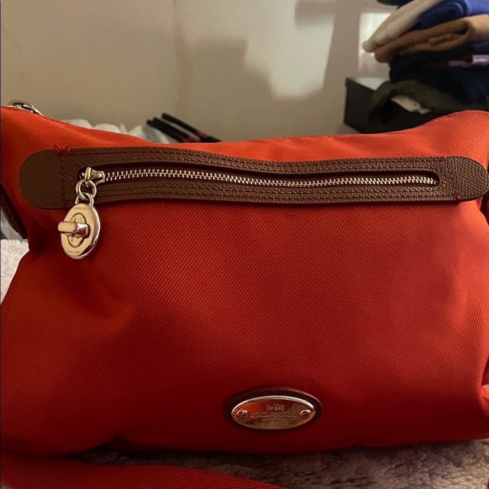 Coach Sawyer VintageVibrant Orange Canvas/Tan leather Crossbody Bag 11”L x 6.5”H